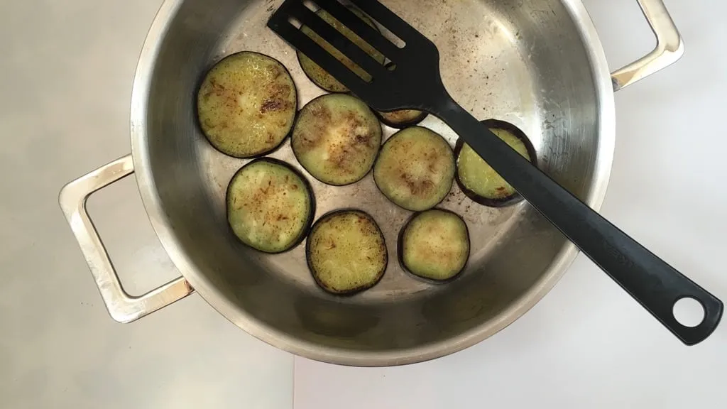 This refreshing and soothing eggplant in yogurt sauce is a great side dish to serve with your next spicy Indian curry dinner!