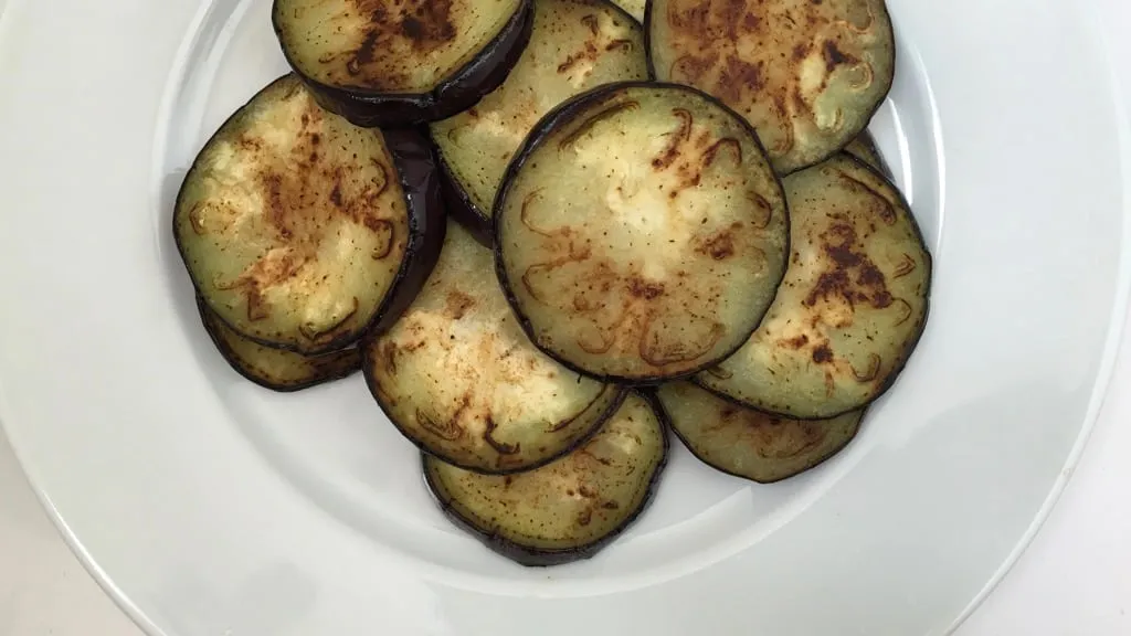This refreshing and soothing eggplant in yogurt sauce is a great side dish to serve with your next spicy Indian curry dinner!