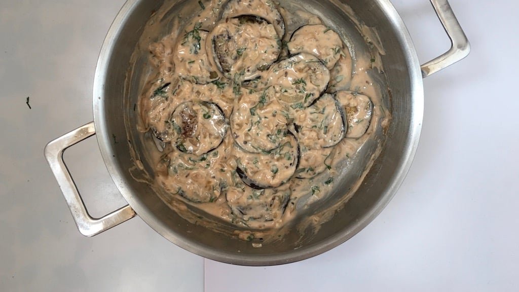 This refreshing and soothing eggplant in yogurt sauce is a great side dish to serve with your next spicy Indian curry dinner!