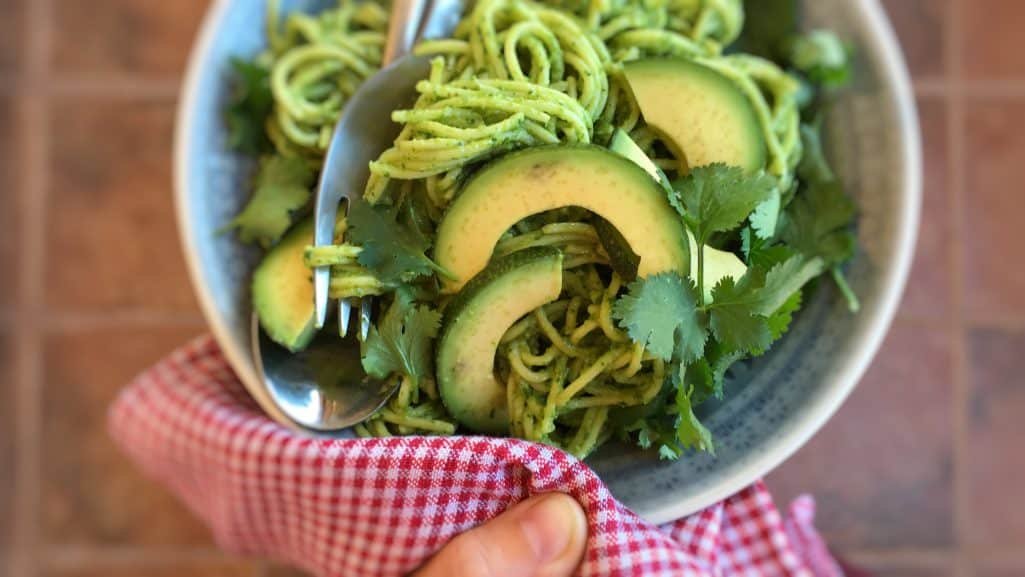 A healthy vegetable pasta sauce with a interesting twist: this creamy avocado pesto spaghetti with cilantro is highly addictive!
