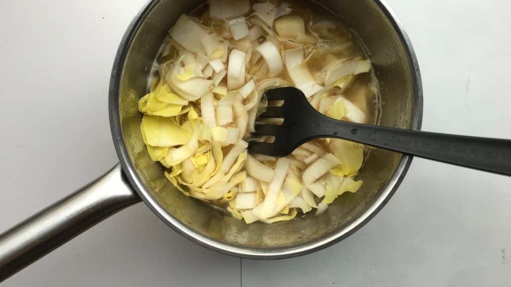 Top notch Belgian products in this beer and endive soup! Fresh endives, grey North Sea shrimp, a local strong ale and grated Belgian trappist cheese!