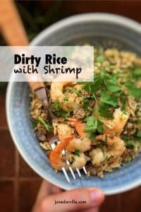 Easy Dirty Rice with Shrimp Recipe Dirty rice with shrimp? You will love this bowl of stir fried buttery rice, chopped liver bits, shrimp and hints of cumin and paprika!