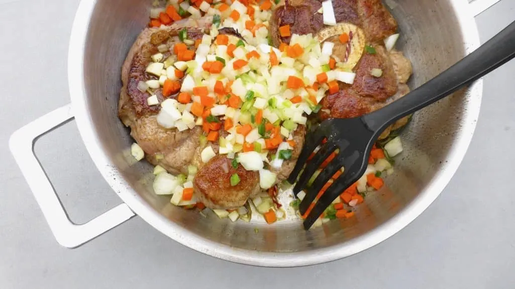 Traditional ossobuco alla Milanese! Or classic braised veal shanks in a flavorful tomato wine sauce with zesty gremolata...
