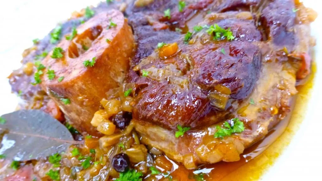 Traditional ossobuco alla Milanese! Or classic braised veal shanks in a flavorful tomato wine sauce with zesty gremolata...