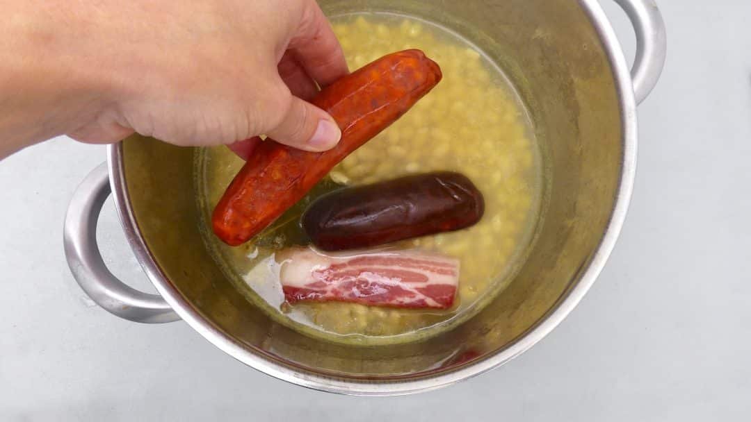 Spanish fabada asturiana, a great bean stew with smoked chorizo sausage, a thick slab of panceta and one blood sausage...