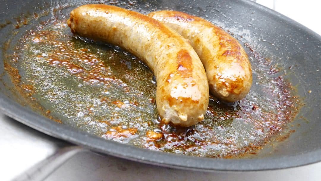 This is hands down my husband's favorite comfort food: fried bangers and creamy potato mash topped with a strong onion guinness gravy!