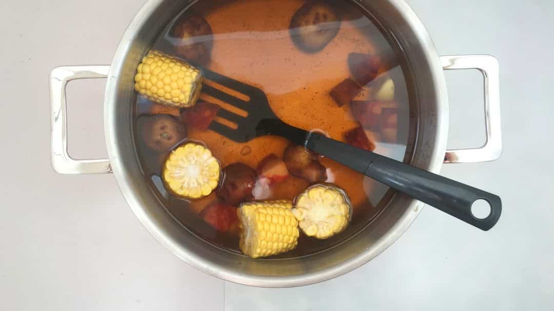 Finger lickin' good... classic shrimp boil with corn, potatoes, sausage and Old Bay seasoning of course!! Delicious summer fest...