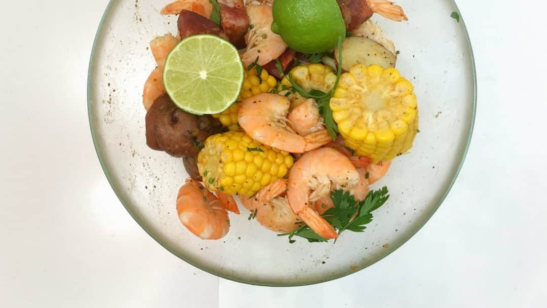 Finger lickin' good... classic shrimp boil with corn, potatoes, sausage and Old Bay seasoning of course!! Delicious summer fest...