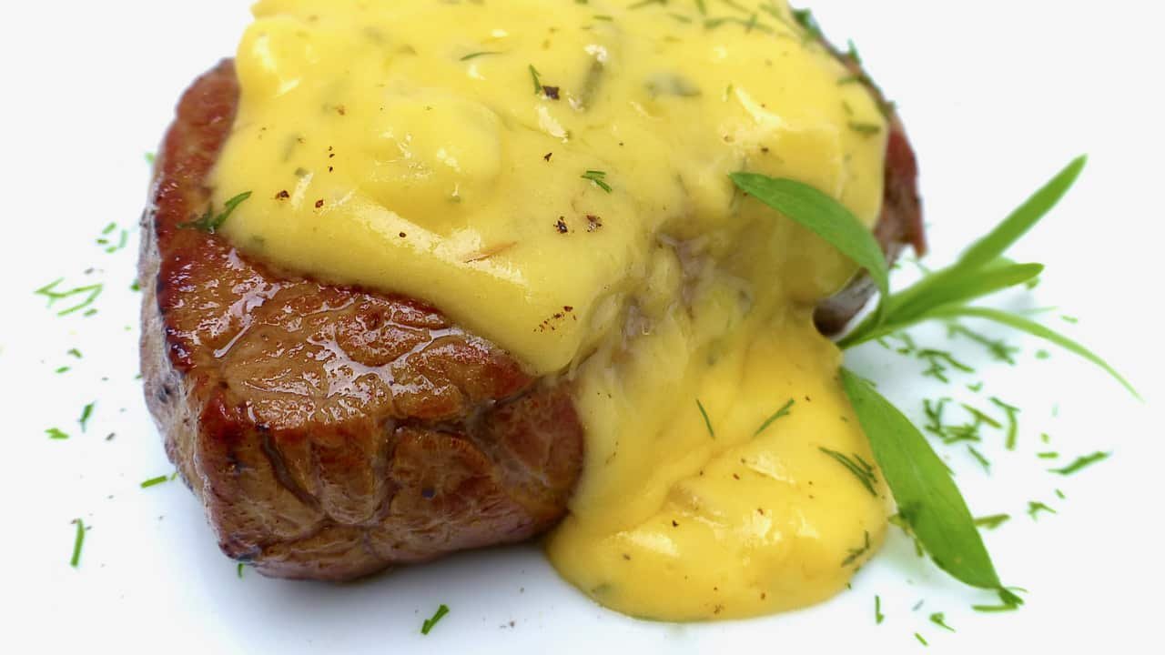 You will love this classic bearnaise sauce recipe! It is a delicious tarragon and butter sauce for your next steak dinner. Sauce béarnaise in French.