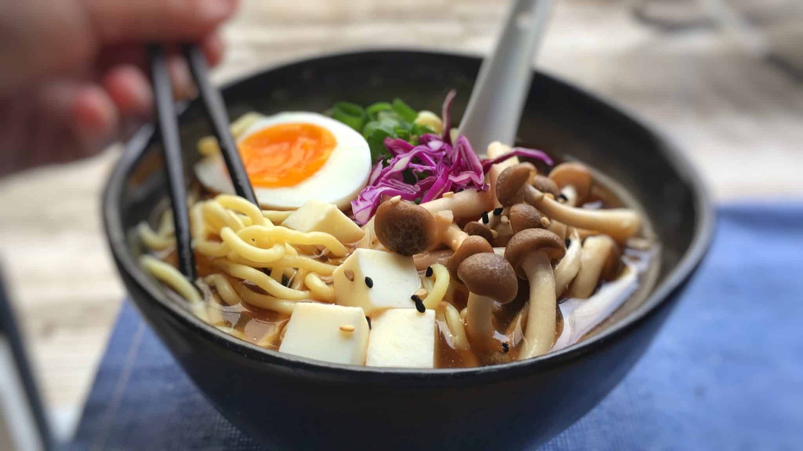 Noodles, miso broth, mushrooms, spring onion, tofu and a creamy soft-boiled egg. That's all you need here. You can make this simple Japanese miso ramen at home!