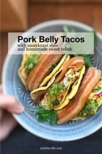 Beer and soy sauce braised pork belly tacos topped off with a refreshing sauerkraut salad and a dollop of homemade sweet relish... These tacos are to die for!