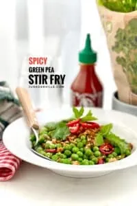 Pea stir fry with explosive Asian flavors: oyster sauce, freshly grated ginger, soy sauce, sriracha chili sauce, tomato paste and lemon juice!