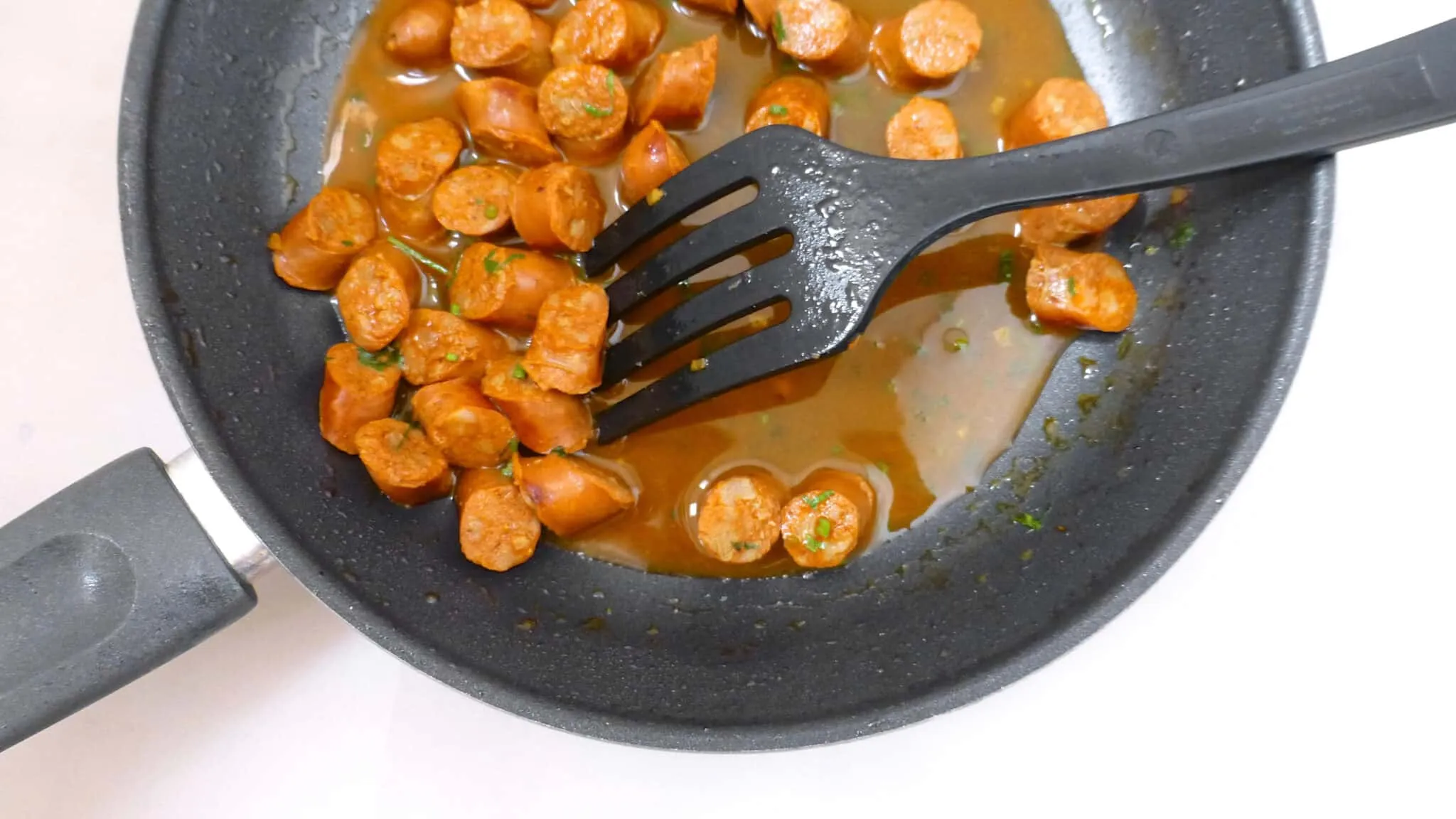 Chorizo a la sidra or chorizo sausage in apple cider, a Spanish classic! And a new addition to my Spanish tapas dinner with friends!