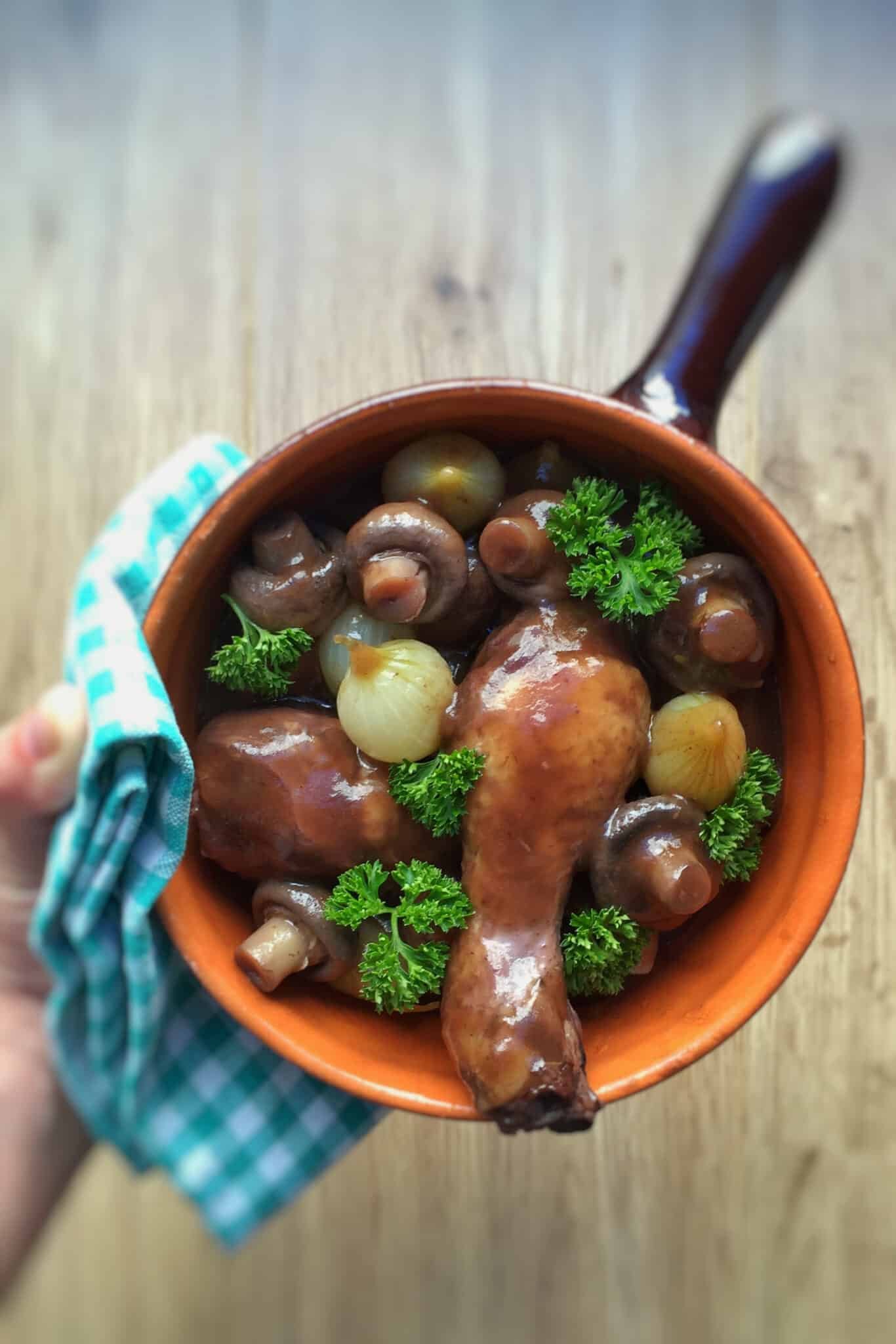Classic coq au vin recipe, a French chicken in red wine stew with mushrooms! And a great make ahead dinner... Serve with mashed potatoes or fries!