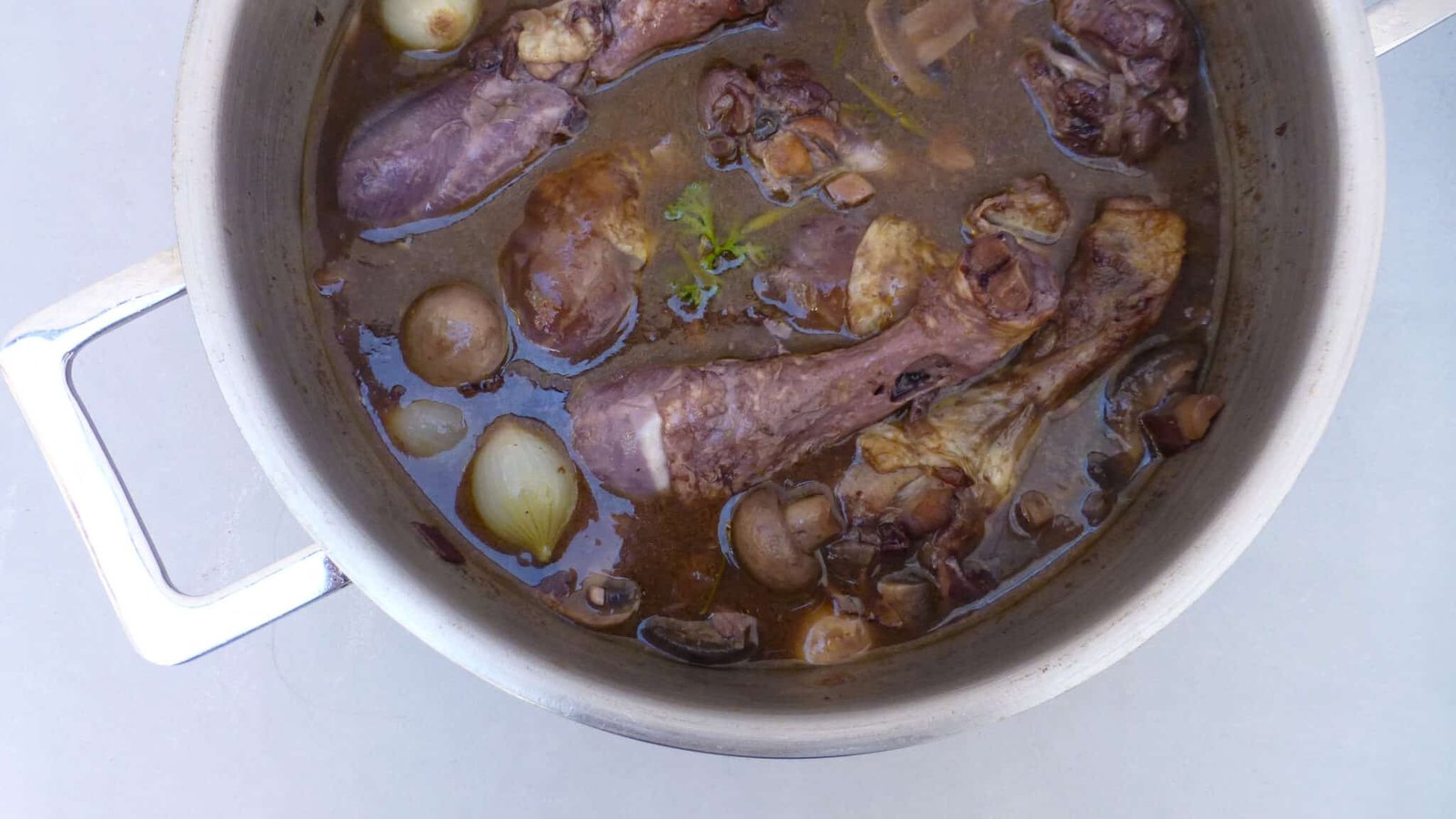 Classic coq au vin recipe, a French chicken in red wine stew with mushrooms! And a great make ahead dinner... Serve with mashed potatoes or fries!