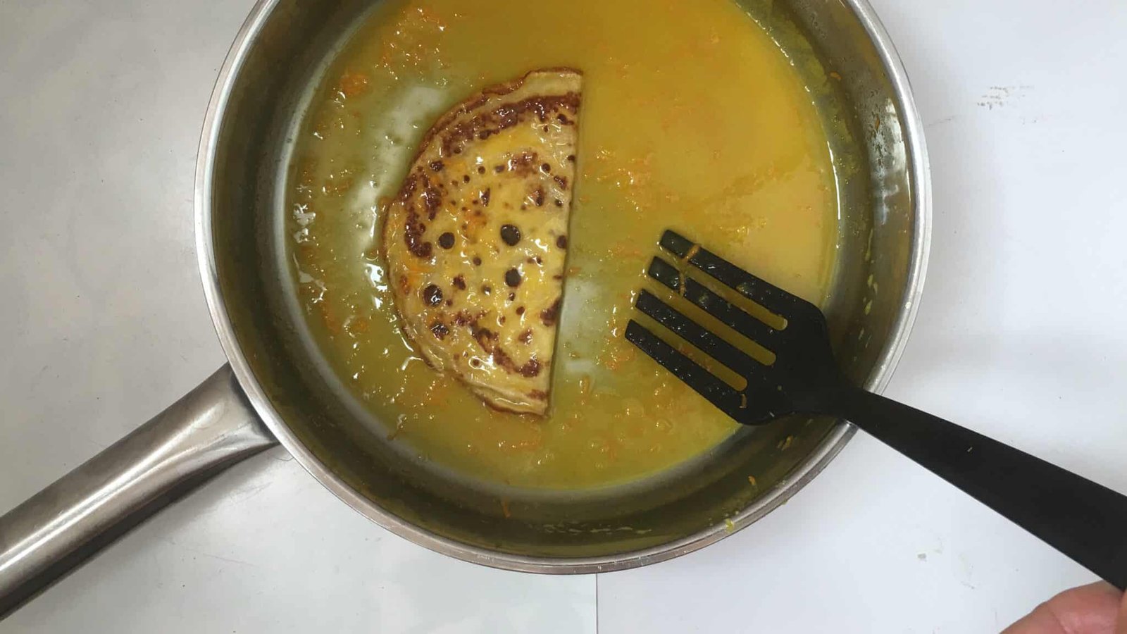 Homemade thin crepes in a sugary orange and Grand Marnier sauce... this crepes suzette recipe is a must try! You will love it...