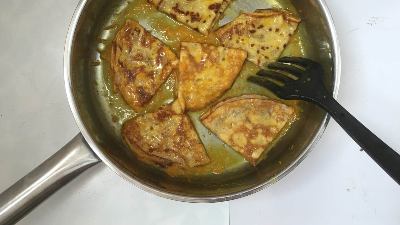Homemade thin crepes in a sugary orange and Grand Marnier sauce... this crepes suzette recipe is a must try! You will love it...