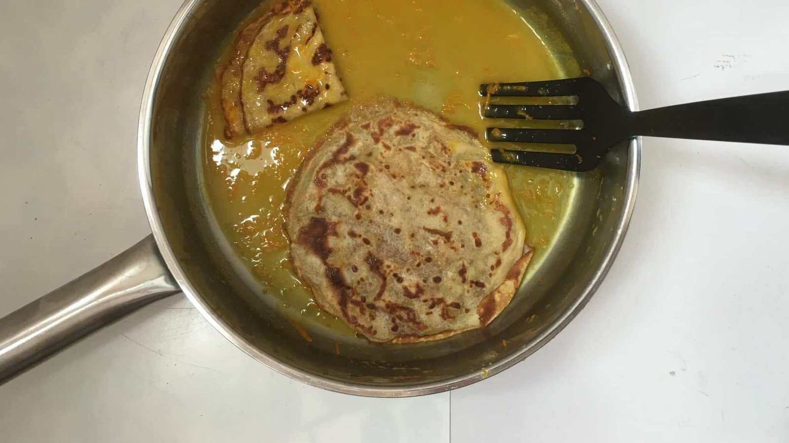 Homemade thin crepes in a sugary orange and Grand Marnier sauce... this crepes suzette recipe is a must try! You will love it...