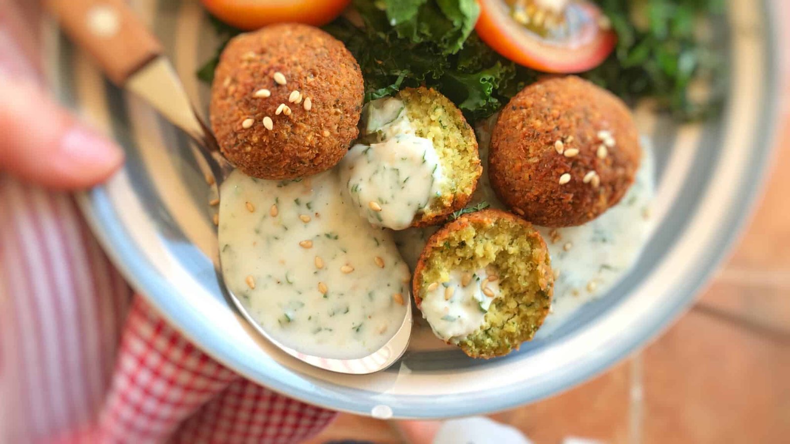 Looking for a homemade falafel sauce? Try out my simple yogurt falafel sauce with sesame oil: the best falafel diping sauce ever!