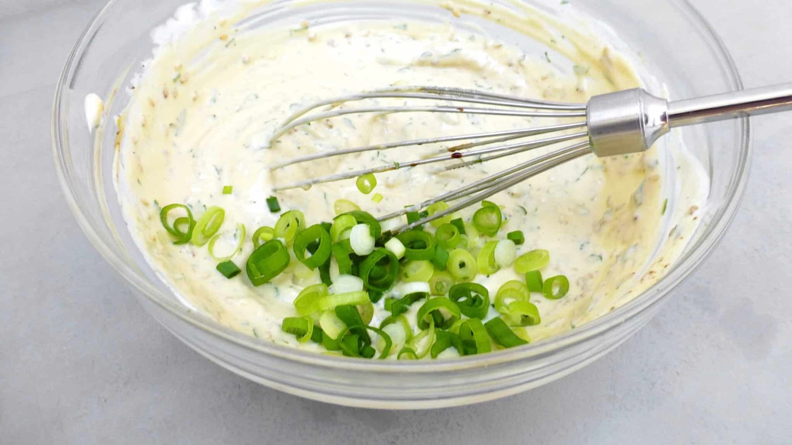 Looking for a homemade falafel sauce? Try out my simple yogurt falafel sauce with sesame oil: the best falafel diping sauce ever!