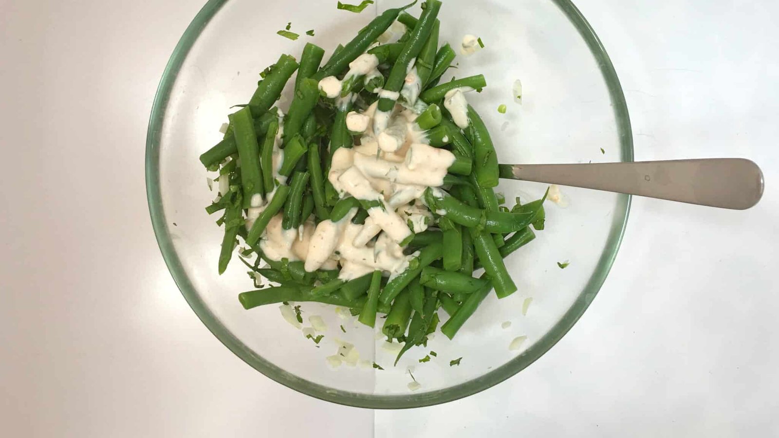 It's BBQ time! This chopped green bean salad in garlic cream cheese dressing is the perfect match for grilled steak or wings!