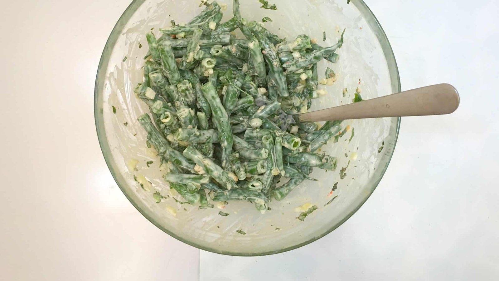 It's BBQ time! This chopped green bean salad in garlic cream cheese dressing is the perfect match for grilled steak or wings!