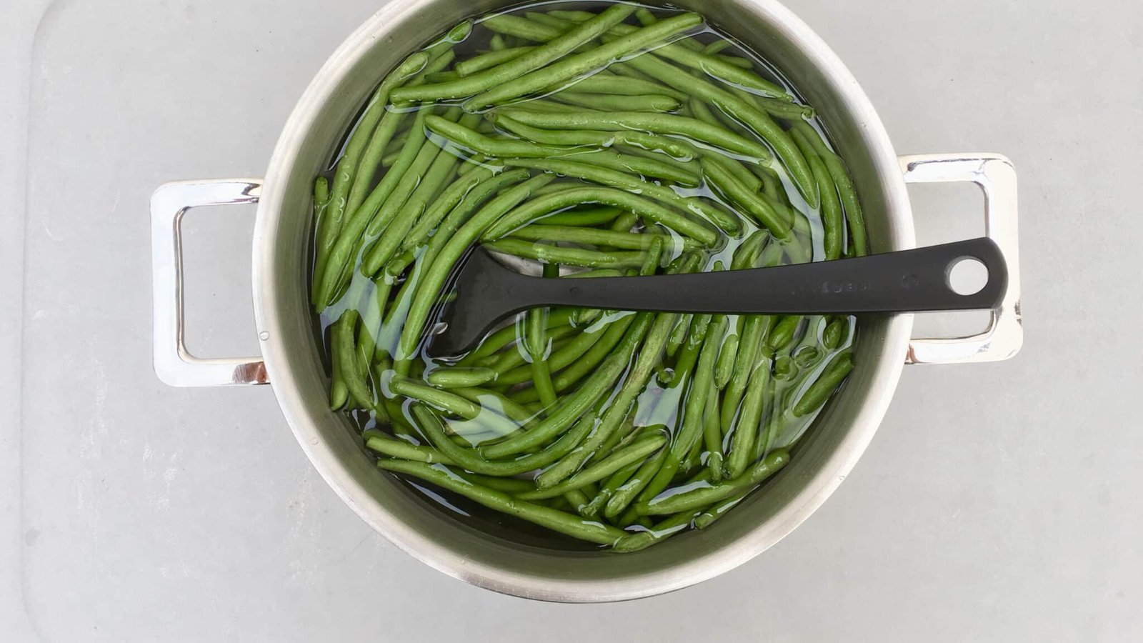 It's BBQ time! This chopped green bean salad in garlic cream cheese dressing is the perfect match for grilled steak or wings!