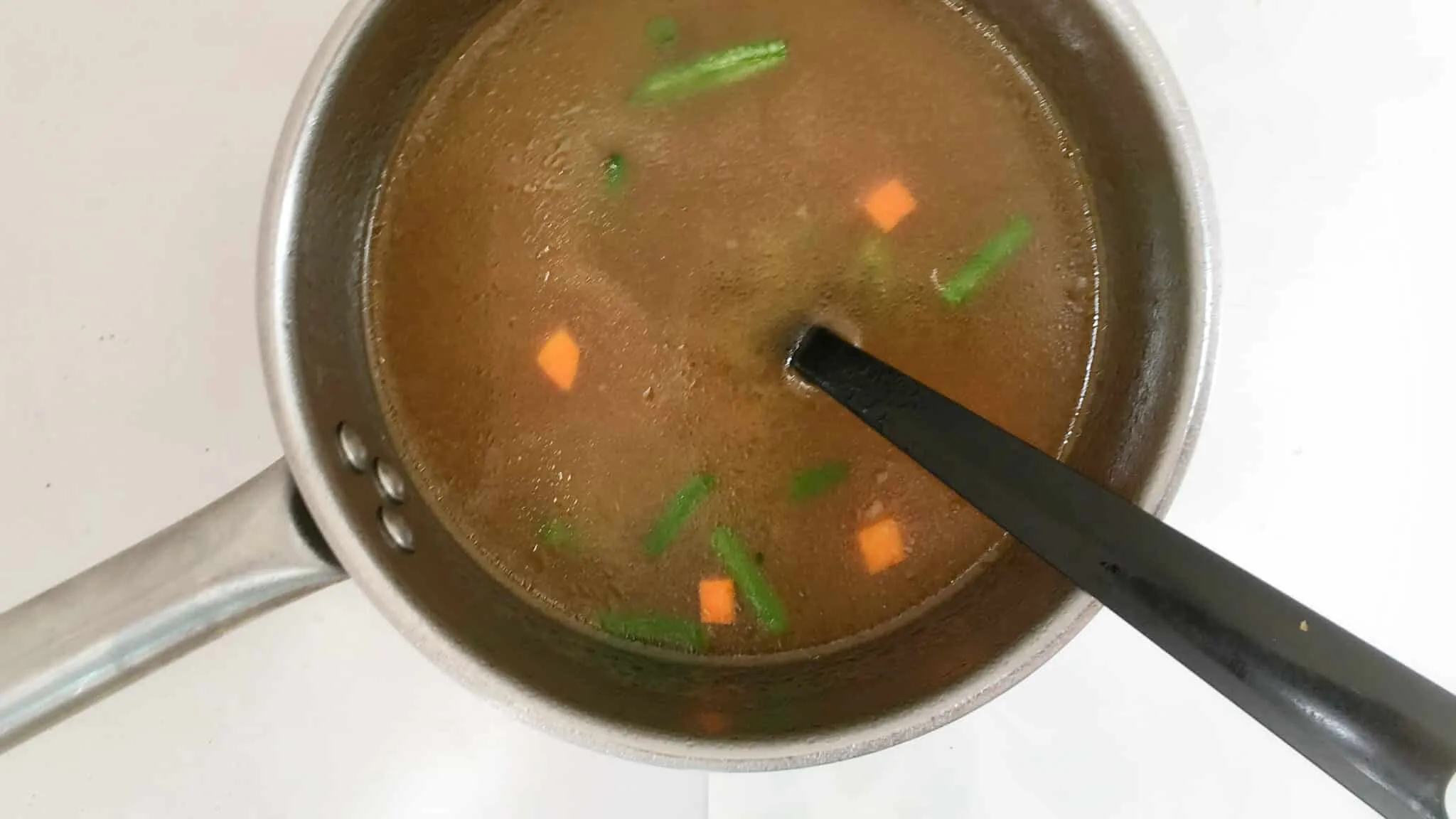 Easy French Pistou Soup French pistou soup: a provençal chunky vegetable soup with peas, green beans, potatoes, zucchini and a spoonful of basil pesto...