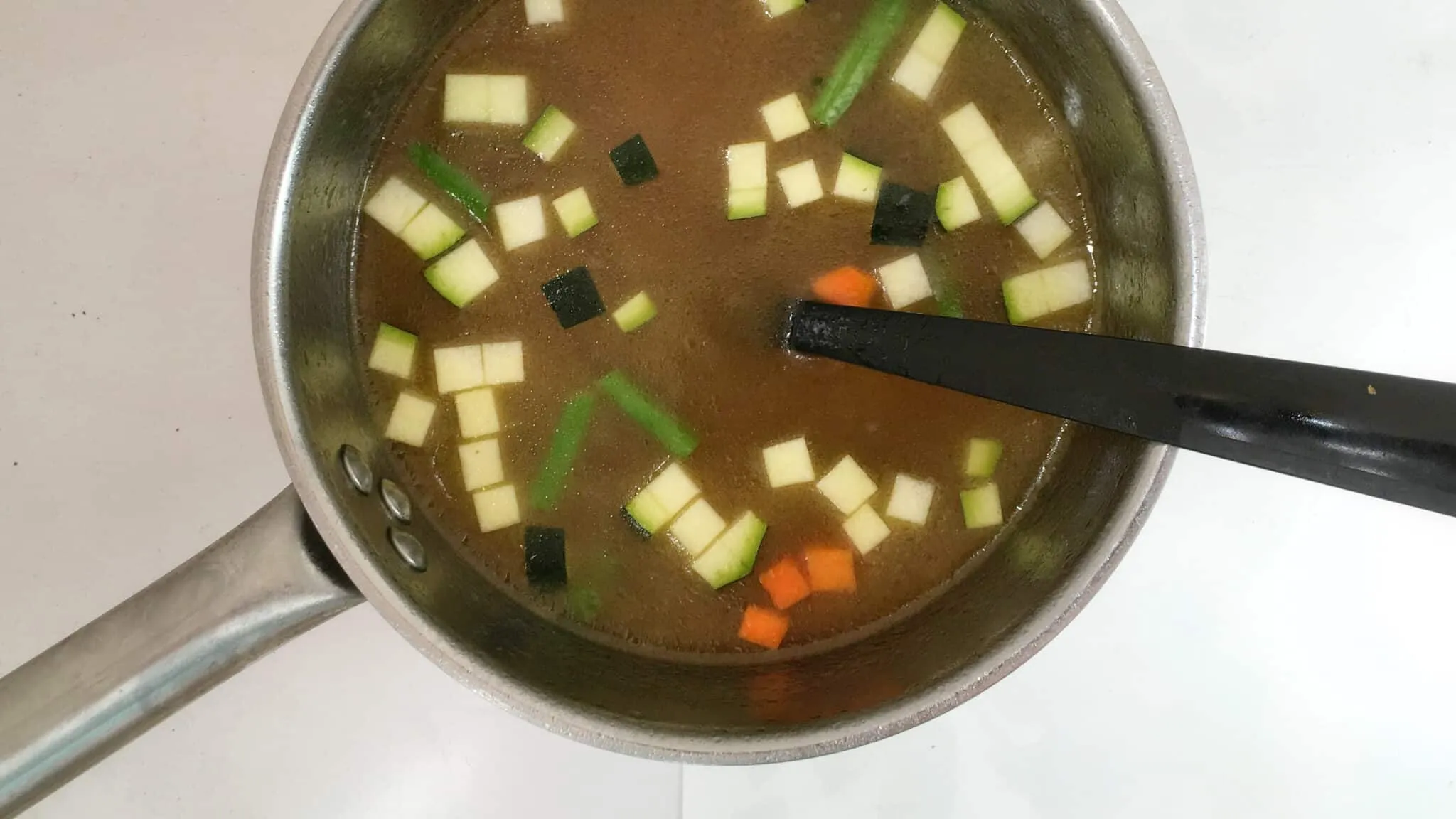 Easy French Pistou Soup French pistou soup: a provençal chunky vegetable soup with peas, green beans, potatoes, zucchini and a spoonful of basil pesto...