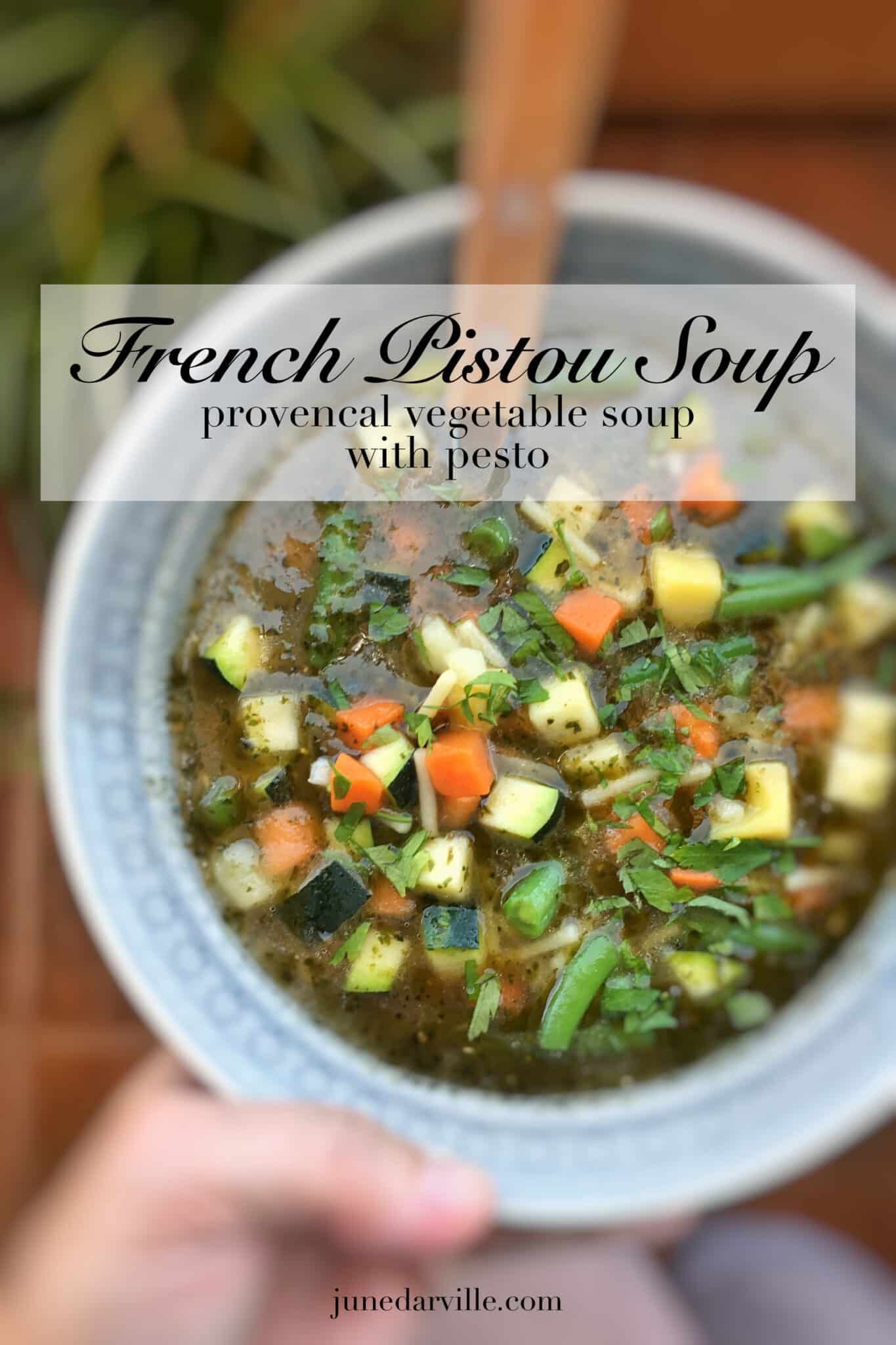 French pistou soup: a provençal chunky vegetable soup with peas, green beans, potatoes, zucchini and a spoonful of basil pesto...