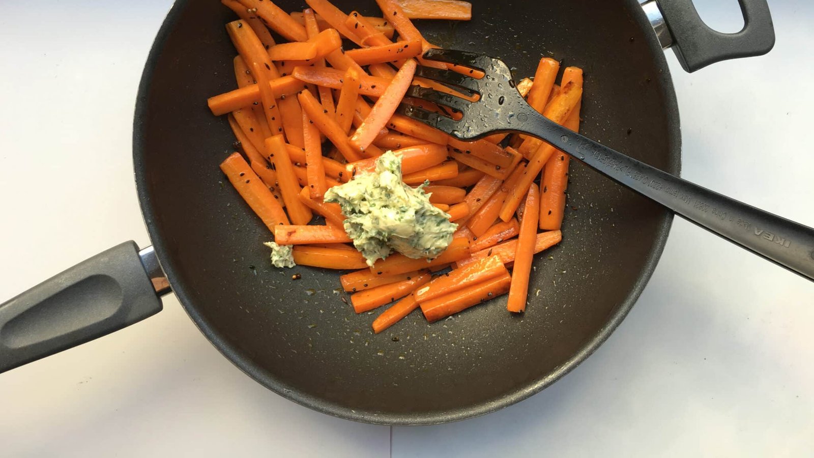 Spiced pan roasted carrots coated with a melted homemade lemon and cilantro butter... A great side dish for juicy pork chops!