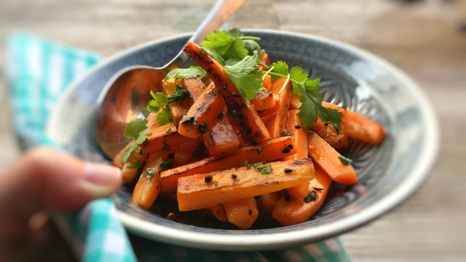 Spiced pan roasted carrots coated with a melted homemade lemon and cilantro butter... A great side dish for juicy pork chops!