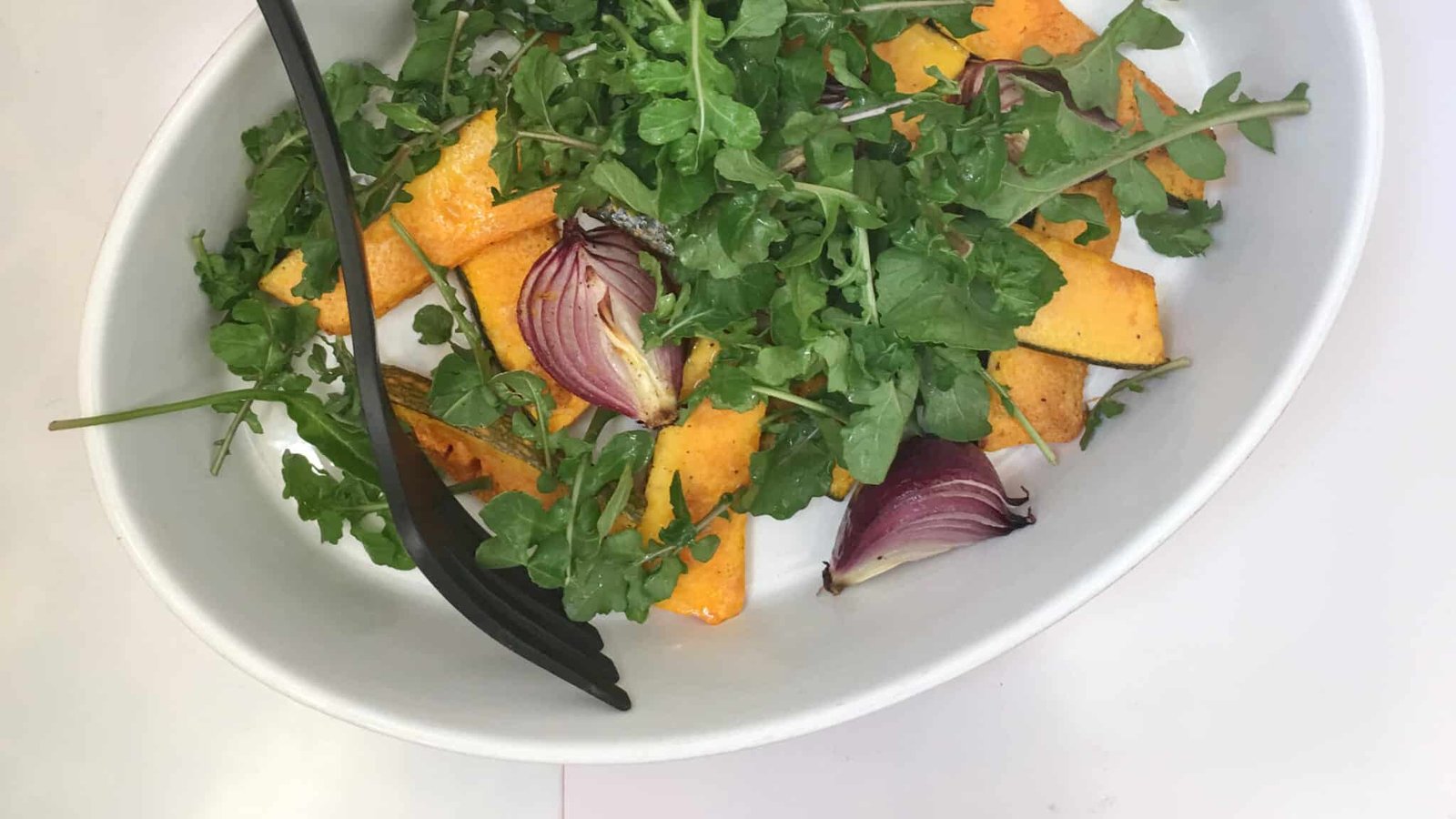 Here's a wholesome roasted pumpkin salad with roasted red onion, arugula, pearl couscous and pumpkin seeds. What a top notch vegetarian dinner this is as well
