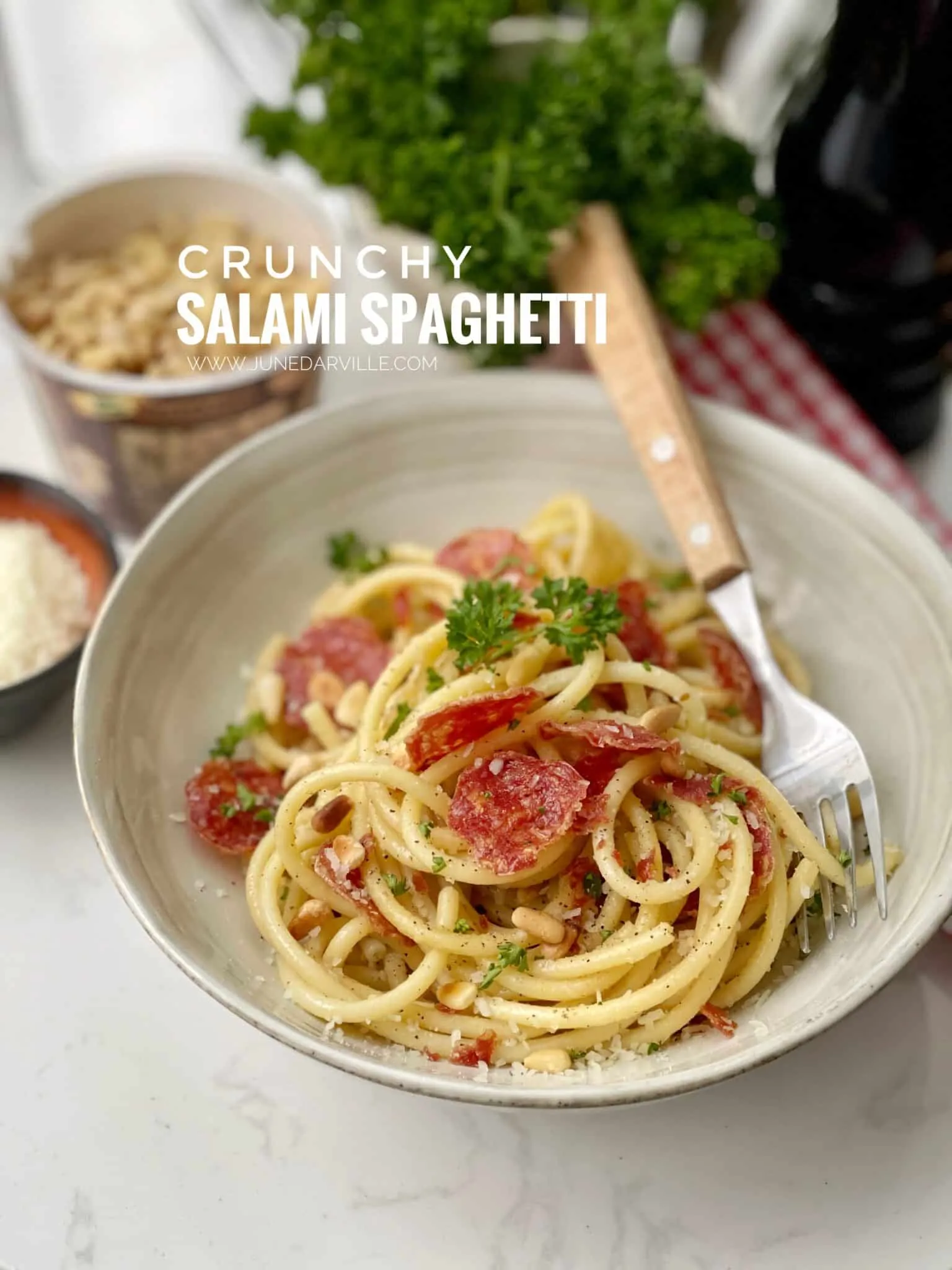 A baked salami pasta recipe, sprinkled with a handful of parmesan cheese... Who would refuse such a savory little Italian dish?