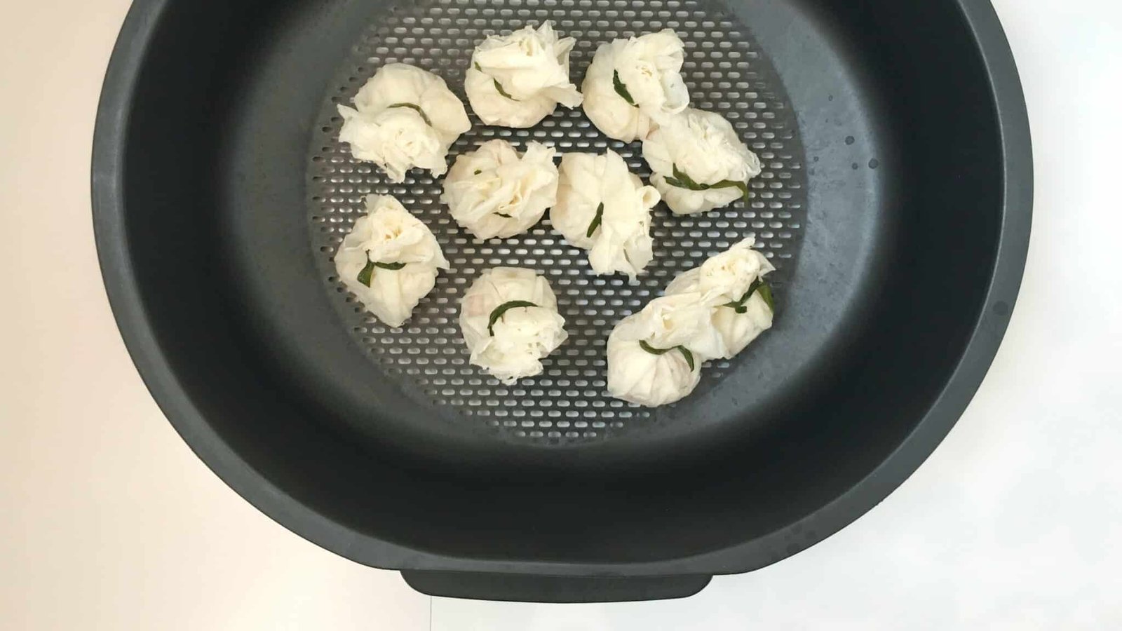 Spicy Szechuan shrimp wonton soup! Chicken stock, hot chili sauce, sesame oil and lime juice... this soup is a hot flavor bomb!