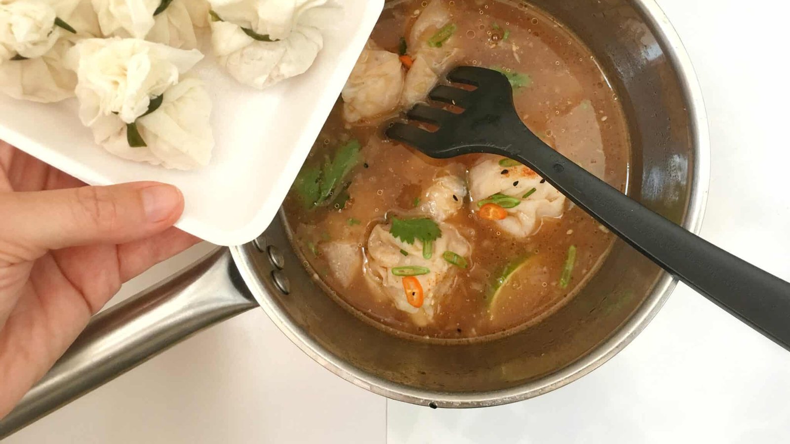 Spicy Szechuan shrimp wonton soup! Chicken stock, hot chili sauce, sesame oil and lime juice... this soup is a hot flavor bomb!