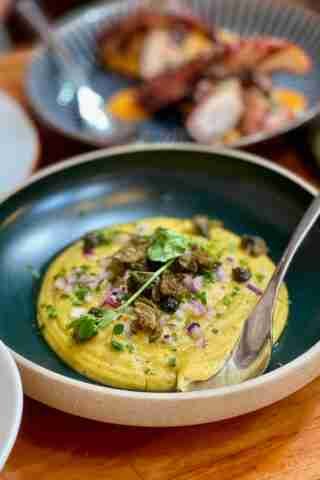 Easy Greek Fava (Yellow Split Pea Dip Recipe) Here's a famous Greek fava bean recipe: a yellow pea dip from Santorini... Served lukewarm and topped with olive oil and chopped onion!