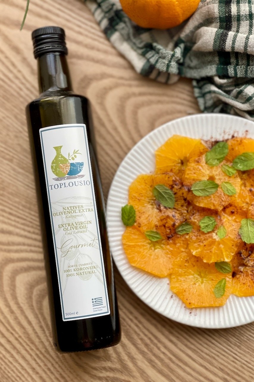 Best Mediterranean Orange Carpaccio (Fresh Citrus Carpaccio Dessert) Mediterranean orange carpaccio with olive oil, cinnamon, and mint on a white plate.