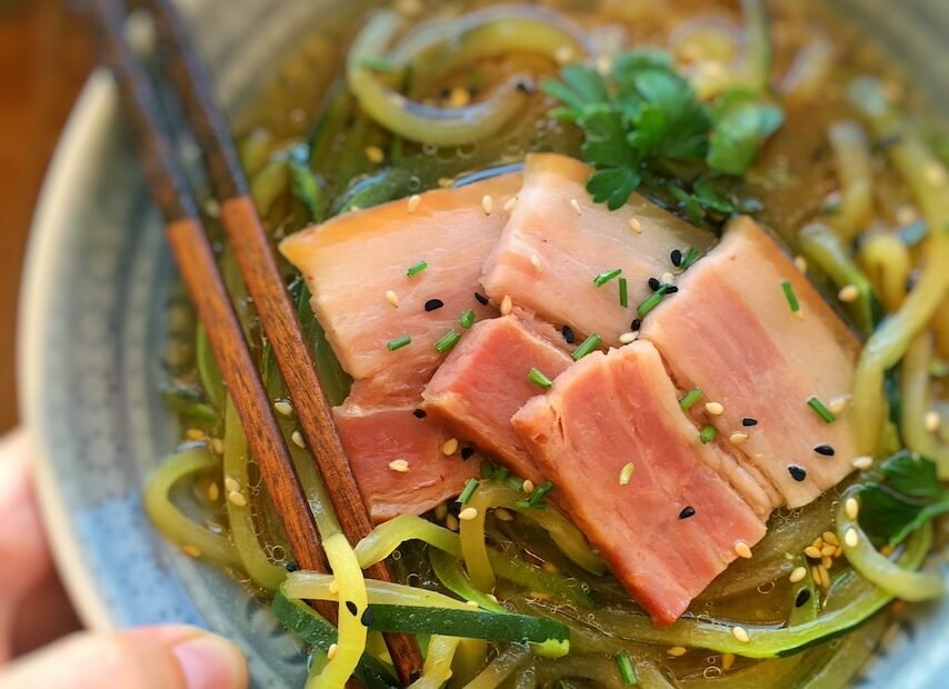 Miso soup with bacon and zucchini noodles in a bowl — low‑carb zoodle miso soup.